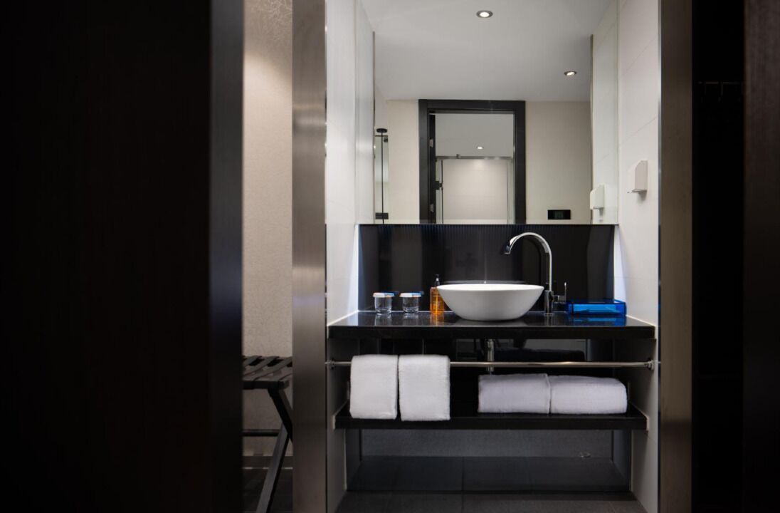 Shower, hair dryer, towels, shampoo