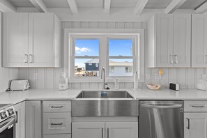 Fridge, microwave, oven, stovetop - South Face: Renovated Oceanfront Pet-Friendly Home in West Beach, perfect for 7 guests! (Oak Island)