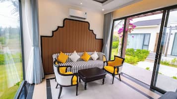 Villa, 2 Bedrooms, Garden View | Minibar, in-room safe, blackout drapes, iron/ironing board