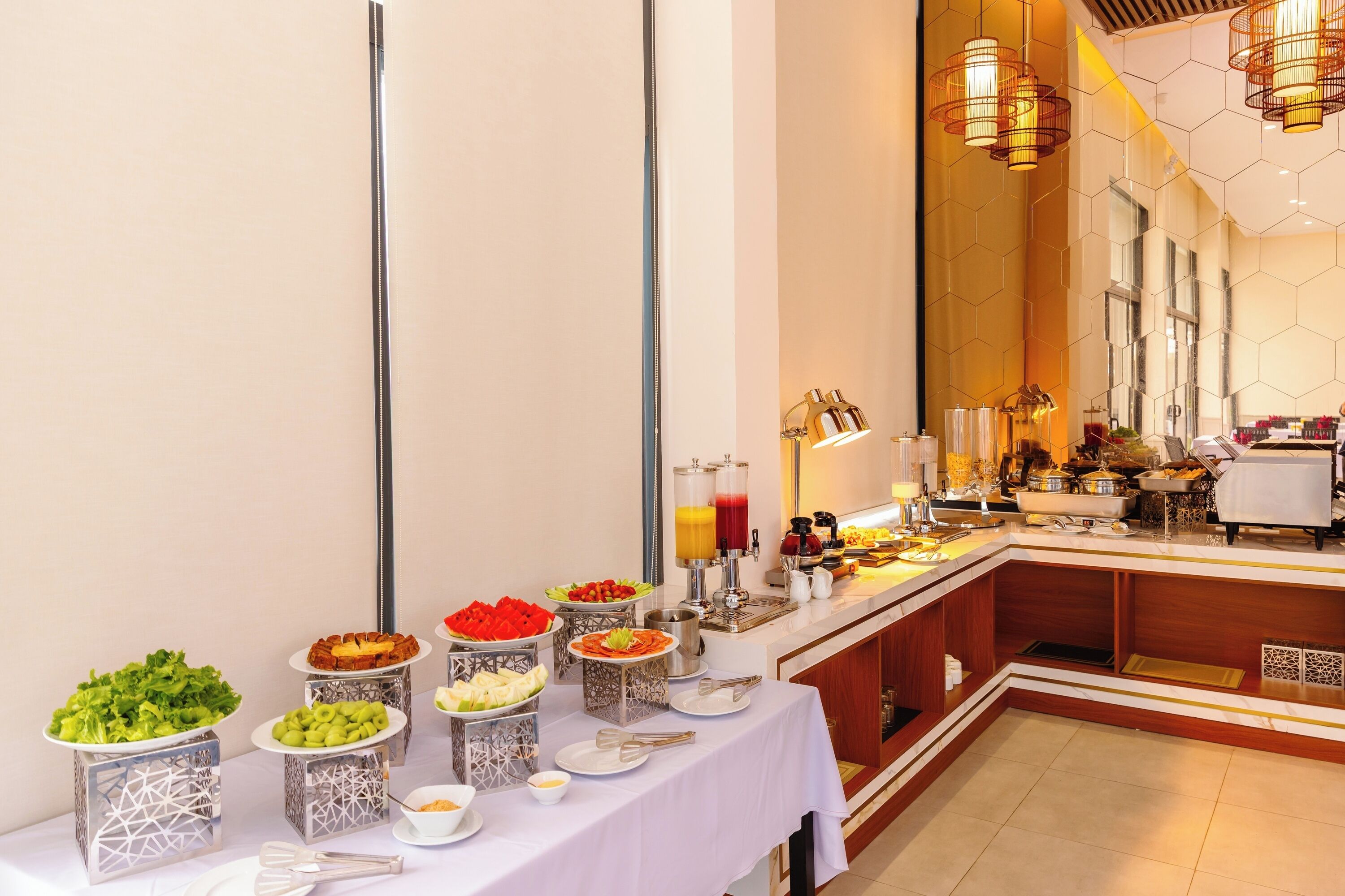 A buffet setup with various food items and a coffee station.