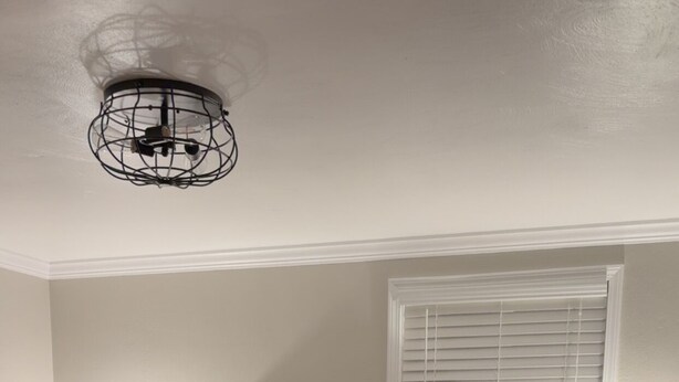 A bedroom with a wooden bed, two bedside tables with lamps, a window with blinds, and a ceiling light fixture. - Entire home just 10 minutes from Pittsburgh's North Shore (Glenshaw)