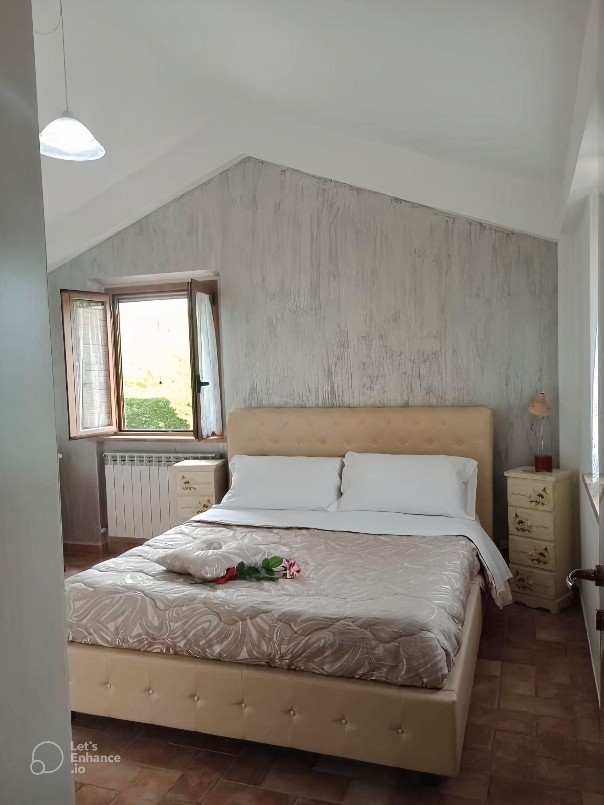 A bedroom with a bed, a window, a radiator, a dresser, and a lamp.