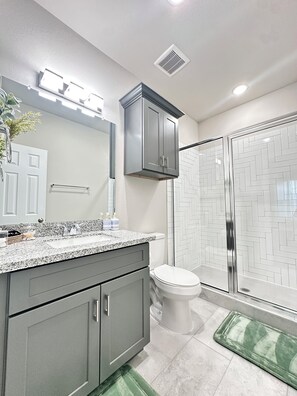 Shower, hair dryer, towels, soap
