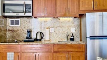 Fridge, microwave, stovetop, coffee/tea maker