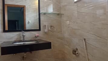 Bidet, towels, soap, toilet paper