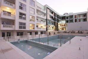 Pool - Relaxing 1BR | Peaceful Family Living in JVC (Dubai)
