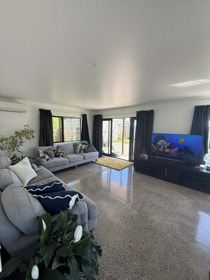 Living area - Papamoa beach bach -beach vibes but home comforts.  Hop, skip, Jump = beach! (Tauranga)