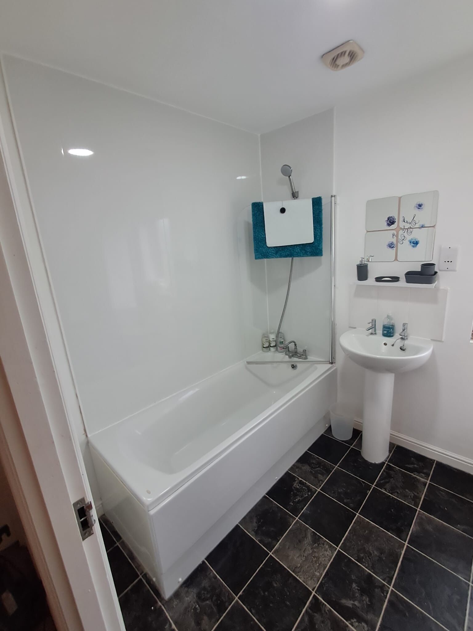 Shower, towels, soap, toilet paper