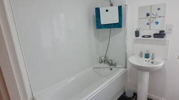 Shower, towels, soap, toilet paper