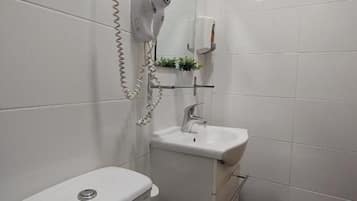 Standard Double Room, Courtyard View | Bathroom | Shower, hair dryer, towels, soap