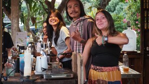 A bar area with a DJ setup, including turntables and a mixer, surrounded by various bottles and glasses. - Boutique Cabin · Peaceful Mountain View (Mueang Ngai)