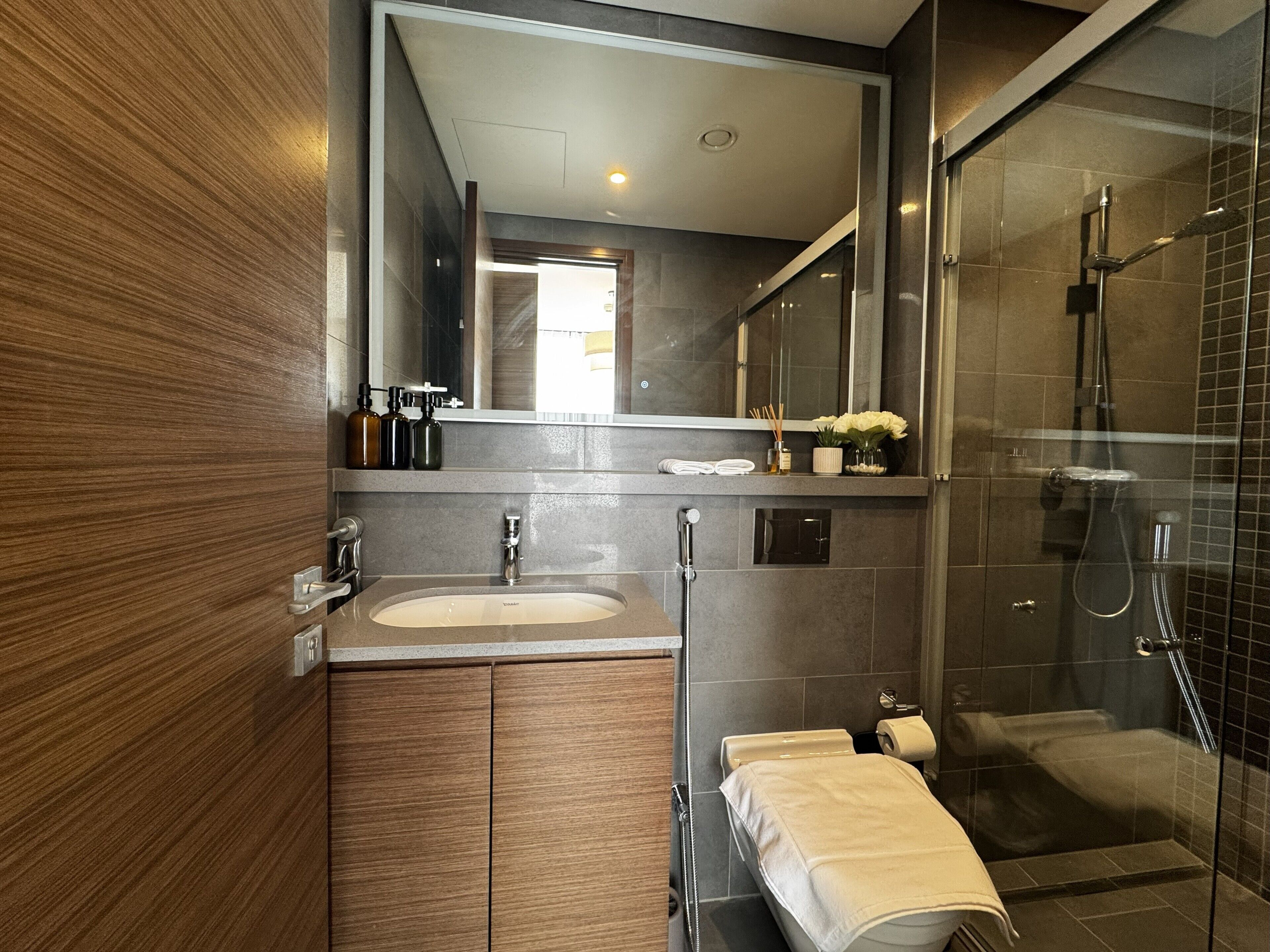 Deluxe Apartment, Balcony, Courtyard View | Bathroom | Shower, rainfall showerhead, free toiletries, hair dryer