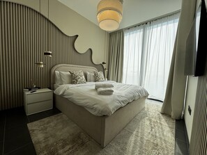 Deluxe Apartment, Balcony, Courtyard View | Premium bedding, memory foam beds, in-room safe, blackout drapes - Luxury 1BR Apartment with Pool Access (Dubai)