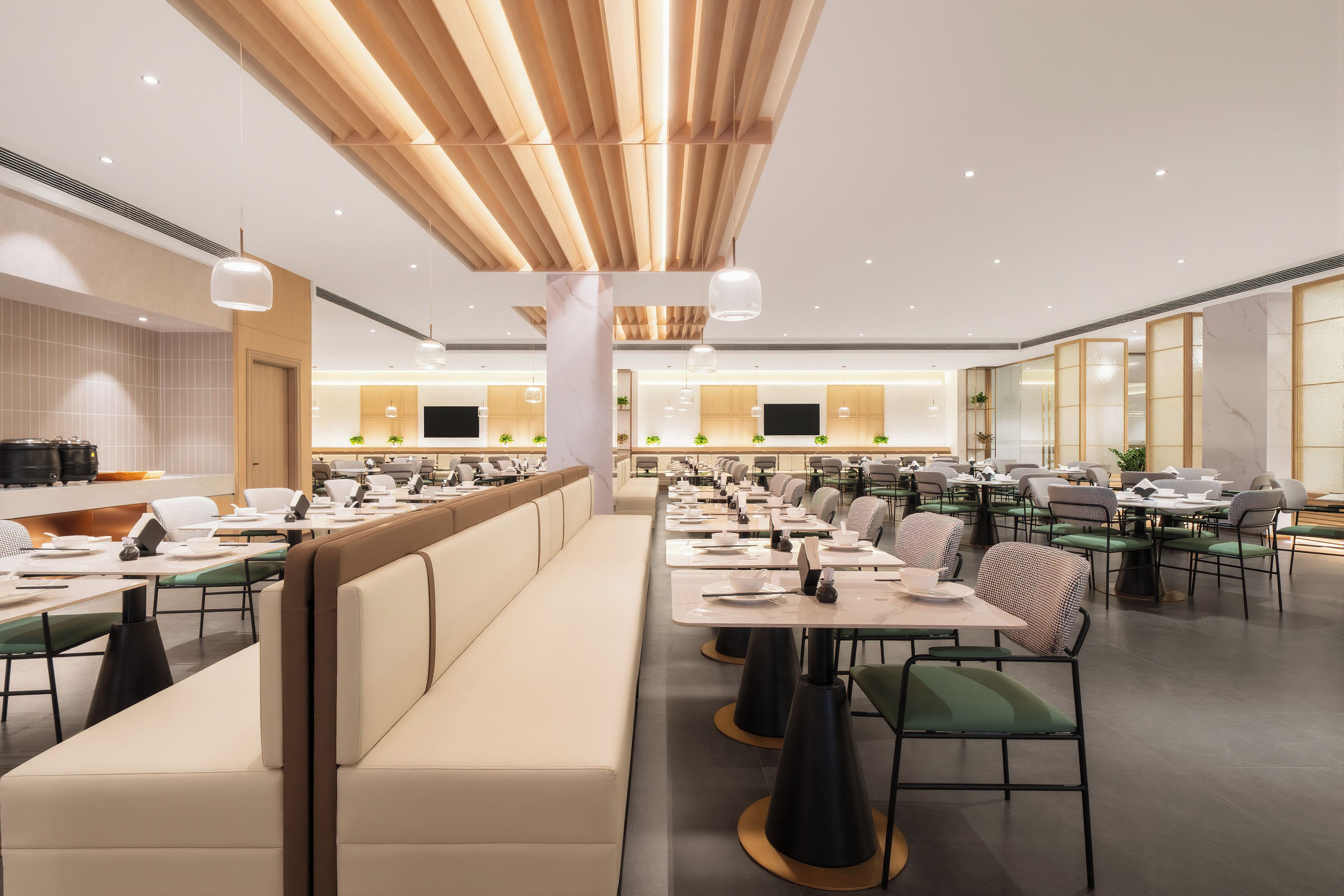 A modern dining area with long communal tables, individual booths, and a wooden ceiling design.