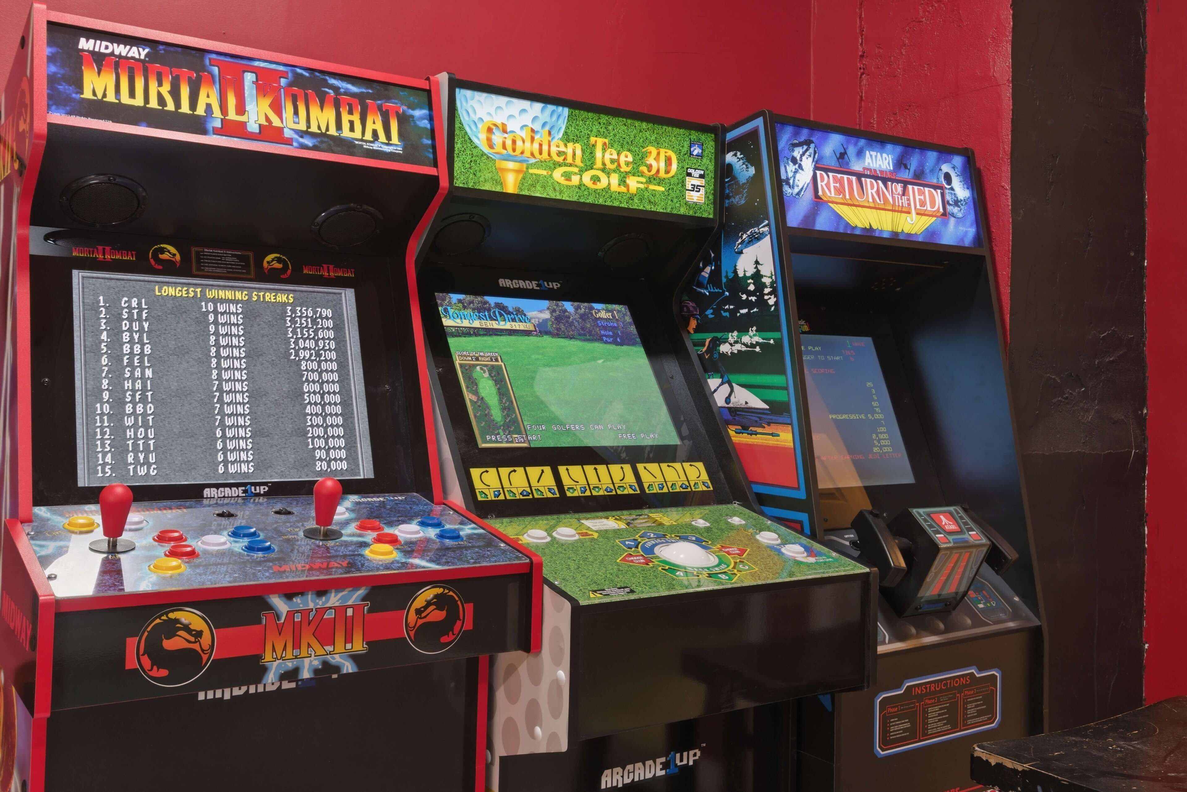 Three arcade machines: Mortal Kombat, Golden Tee 3D Golf, and Return of the Jedi.