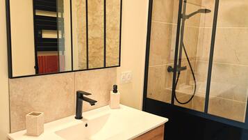 Shower, hair dryer, towels, toilet paper