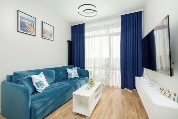 The living room offers a perfect blend of comfort and modern style.