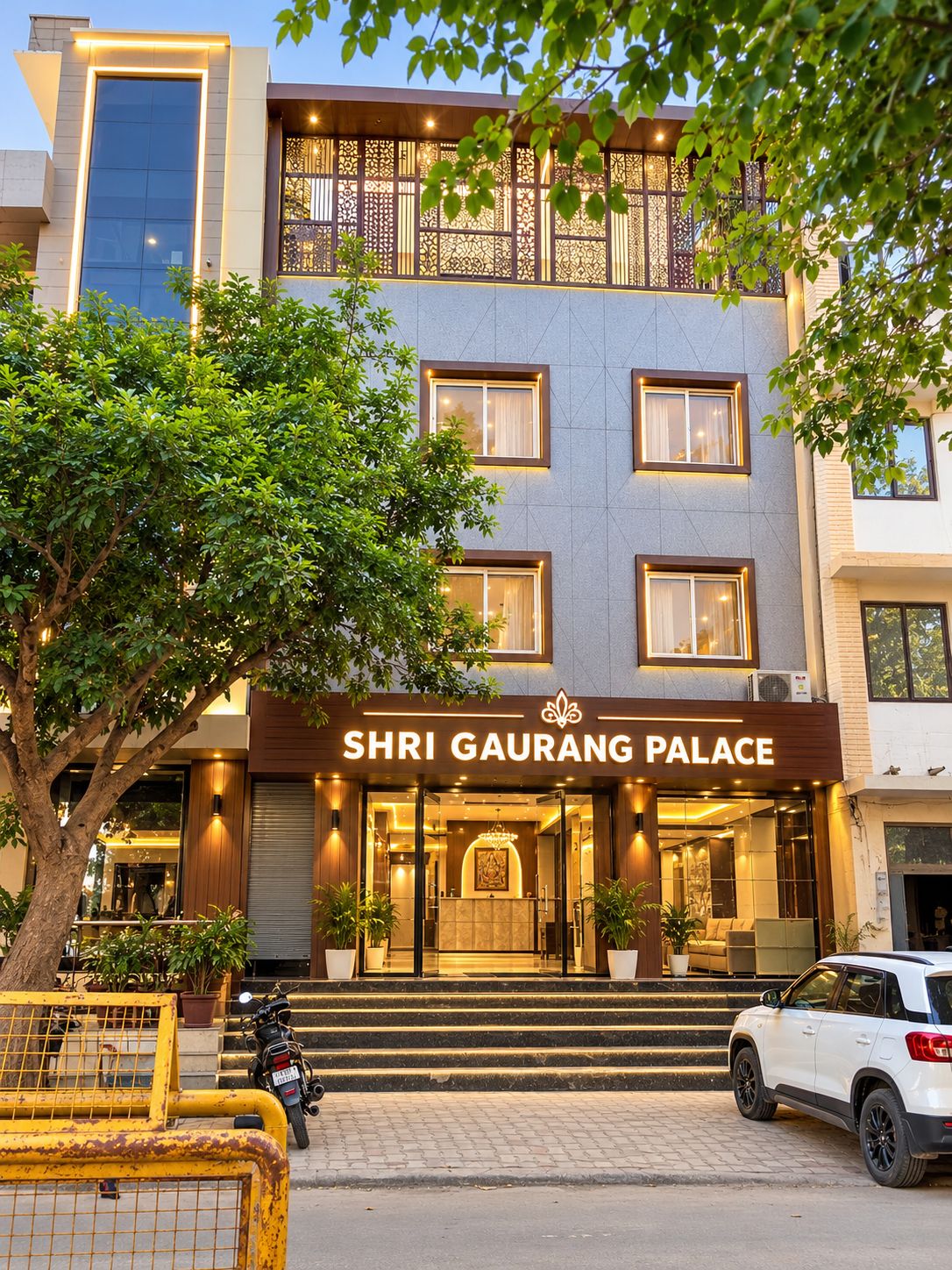 A multi-story hotel with a sign reading 'SHRI GAURANG PALACE.'