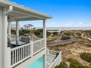 Outdoor dining - 8BR/5.5BA Home - Oceanfront, Water Views, Game Room, Pool, Elevator, Sleeps 20 (Oak Island)