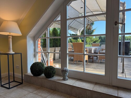 Apartment with large roof terrace, fireplace and carport by the Biesenthal Basin