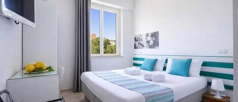 Economy Double or Twin Room | Minibar, in-room safe, desk, free WiFi