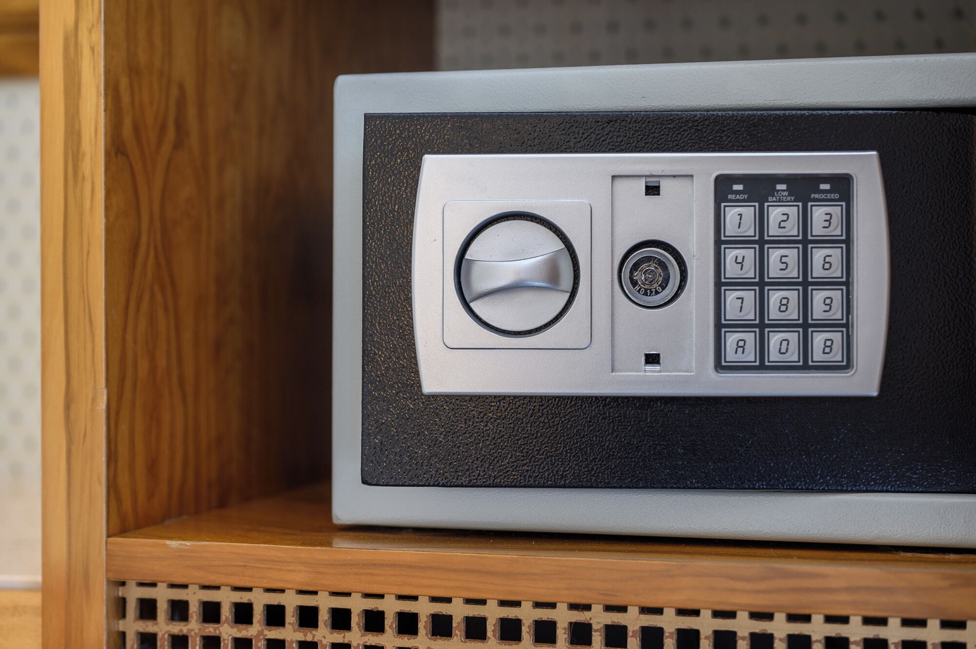 A safe with a combination dial and keypad.