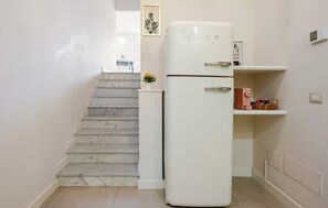 Deluxe Apartment, Courtyard View | Private kitchen | High chair - Spazio Apartments San Giuliano (Catania)