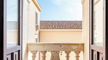 Deluxe Apartment, Courtyard View | Living area | 60-inch Smart TV with digital channels, Netflix, streaming services