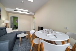 Apartment, Balcony | Living area | Flat-screen TV - RentPlanet - Apartament Brzoskwiniowa (Wrocław)