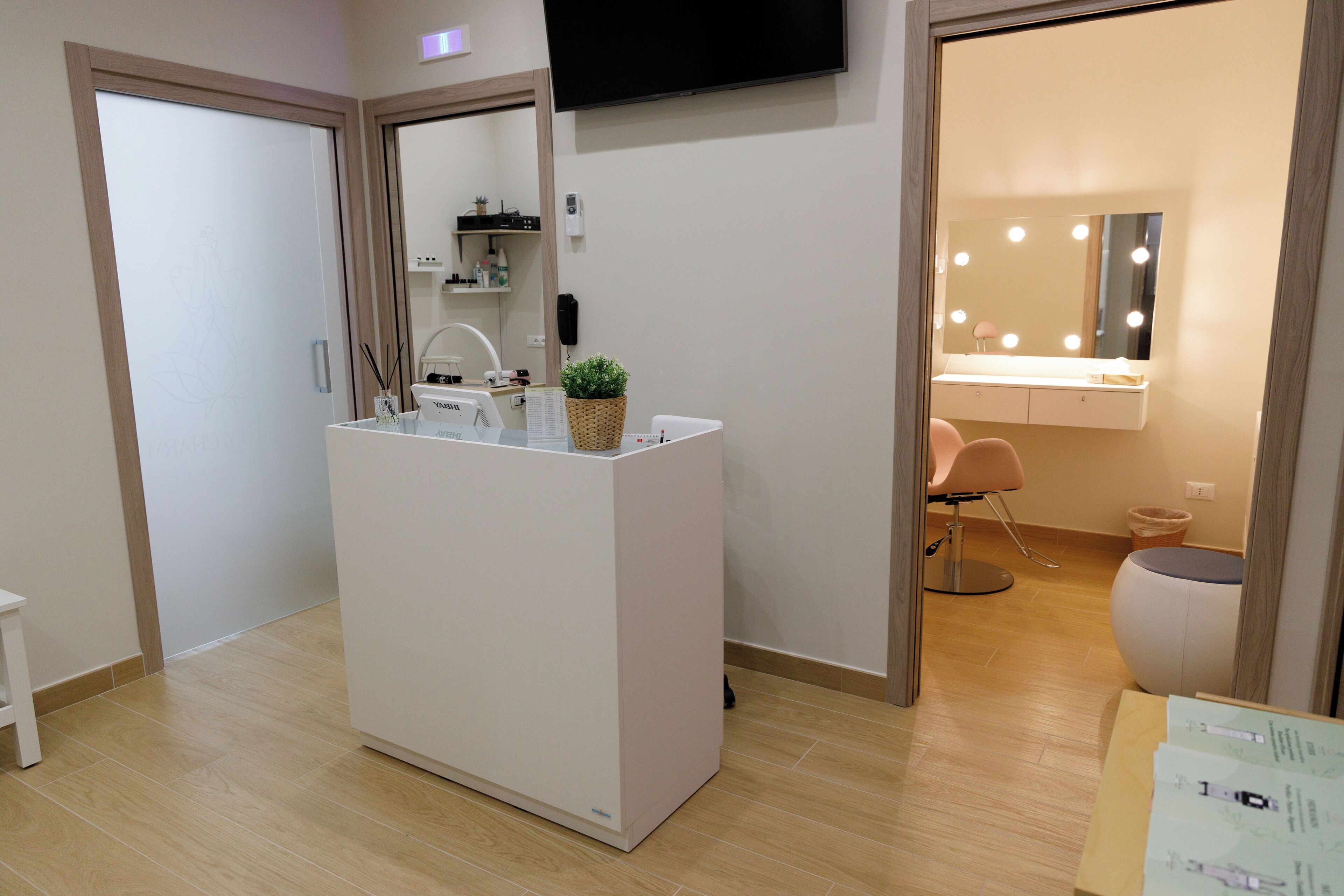 A modern bathroom with a vanity, mirror, and lighting.