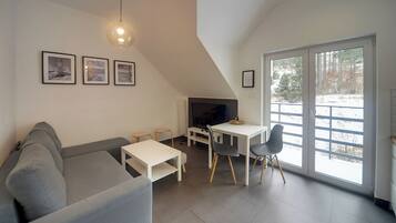 Apartment, Balcony, Mountain View | Living area | Flat-screen TV