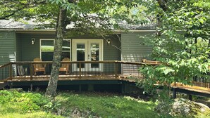 A house with a deck, a front door, and a small porch area. - SW-59 Deaver's Delight  Newly remodeled (Beech Mountain)