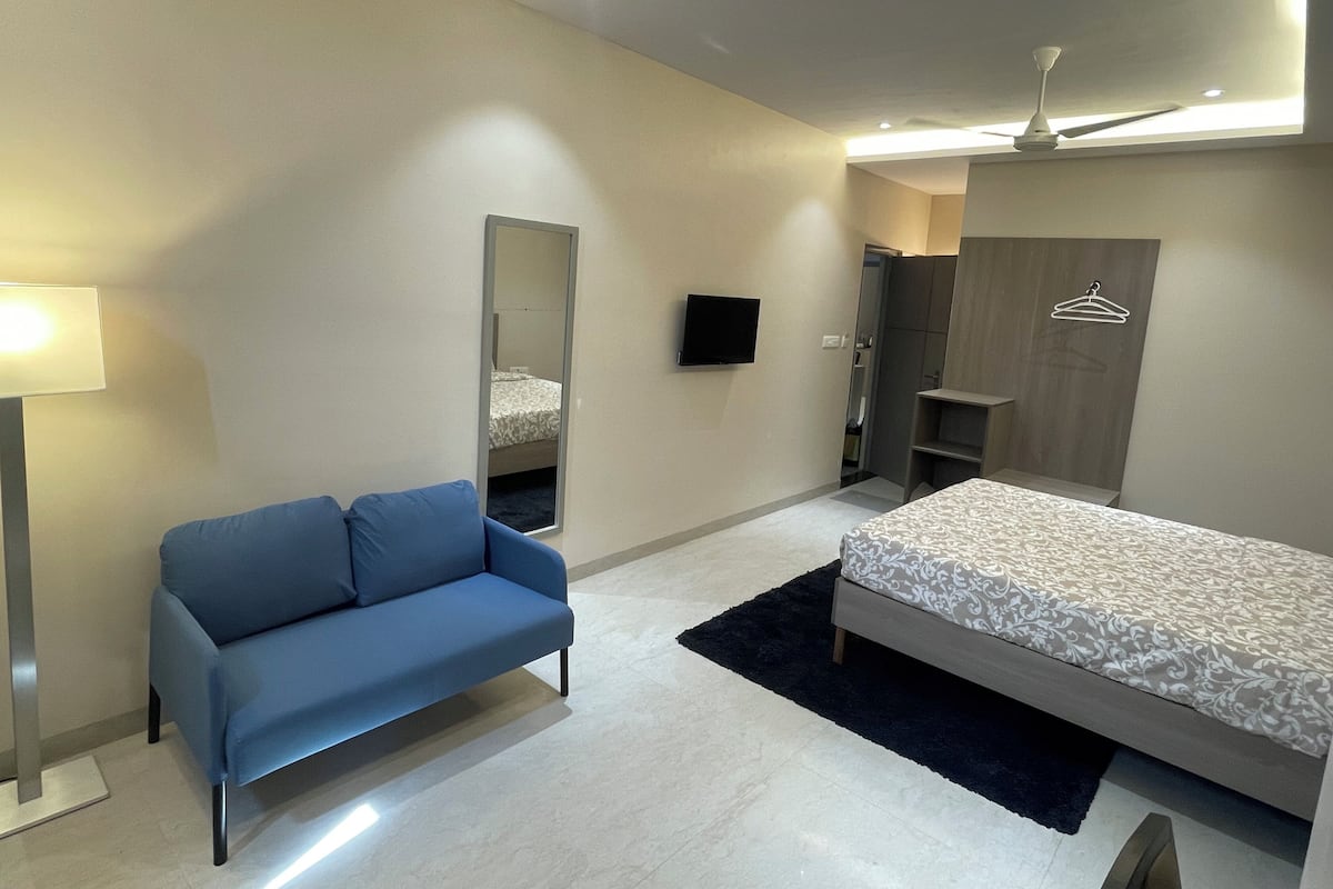 Deluxe Triple Room, City View | Desk, laptop workspace, blackout drapes, soundproofing