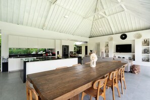 A spacious kitchen with a large island, white cabinetry, and a modern design. - Absolute paradise and still has the charm of a luxury Balinese villa (Badung)