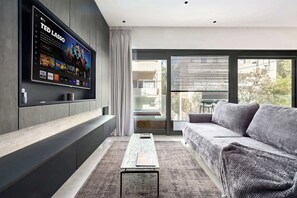 TV - Vibrant Modern 2BR steps to the Beach by HolyGuest (Tel Aviv-Yafo)