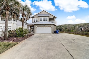A two-story house with a garage, a balcony, and a driveway. - 2641a S Fletcher Ave (Fernandina Beach)