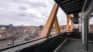 A modern building with a balcony overlooking a street. - 2880: Above the Cityline Elegance at Espadin (Denver)