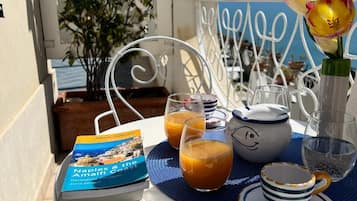 Comfort Room, Balcony, Sea View | Outdoor dining