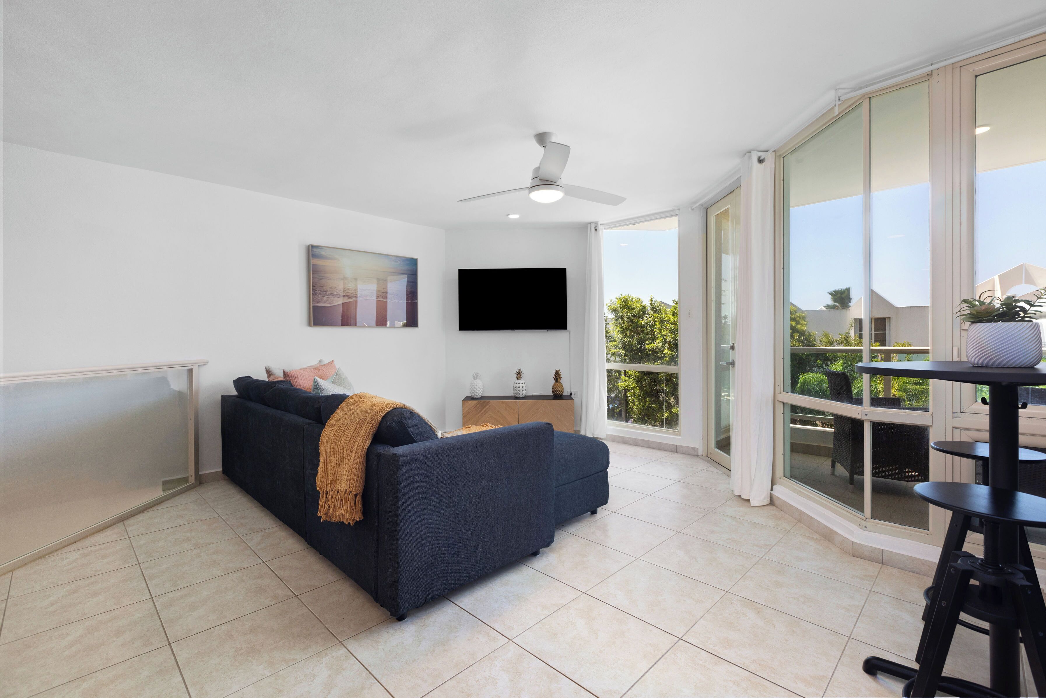 Luxury Apartment, Balcony | Living area | 32-inch LCD TV with digital channels