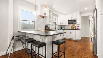 Coffee/tea maker, fridge, microwave, oven