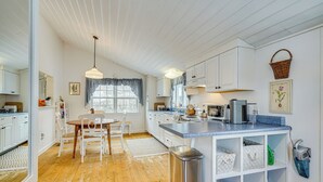 A kitchen with white cabinets, a blue countertop, and a wooden floor. - 12 Mi to Bromley Mtn Ski Resort: Quiet Hideaway (Manchester Center)