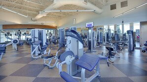 A gym with various exercise machines, a large mirror, and a high ceiling with visible ductwork. - Snowbird Escape w/ Pools! 6 Mi to Dtwn Sarasota (Sarasota)