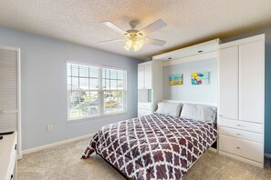 A bedroom with a bed, a ceiling fan, a window, and a wardrobe. - 1 Mi to Beach! Marco Island Family Getaway w/ Pool (Marco Island)