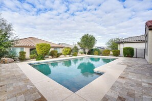 A rectangular swimming pool with a tiled deck surrounding it. - Outdoor Oasis & Amenity Access: Buckeye Retreat (Buckeye)