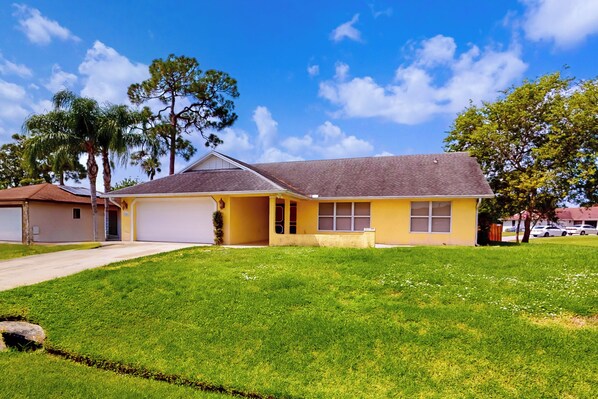 House (3 Bedrooms) | Front of property - 3BR Palm-surrounded Stay w/ Yard & A/C (Port Saint Lucie)