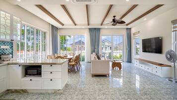 Family Villa, Housekeeping, Garden View | Living area | 29-inch flat-screen TV with cable channels