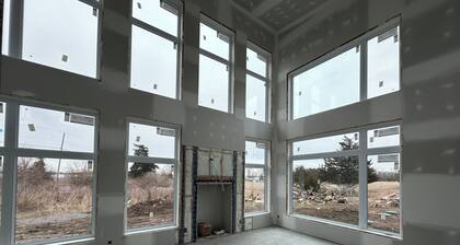 Luxury modern farmhouse on Amherst Island. 152 acres of private, scenic trails.