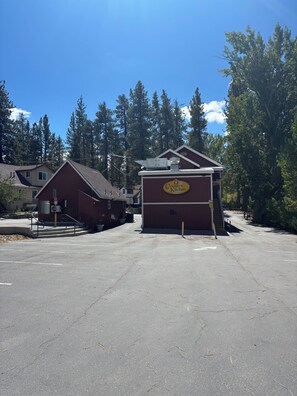 A parking lot with a Country Kitchen restaurant building.