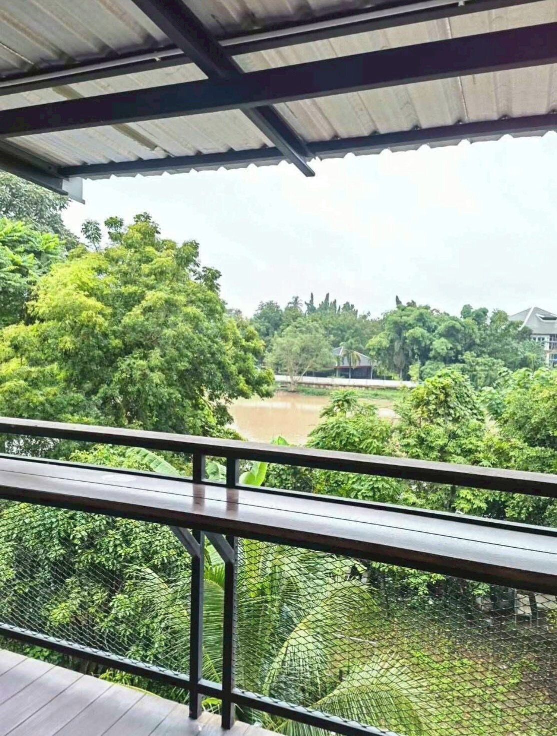 Family Room, River View | Property grounds