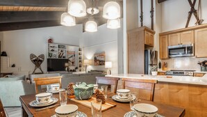 A modern kitchen with wooden cabinets, a microwave, and a stove. - Bright & Modern 3BR/2BA Retreat 644 (Mammoth lakes)